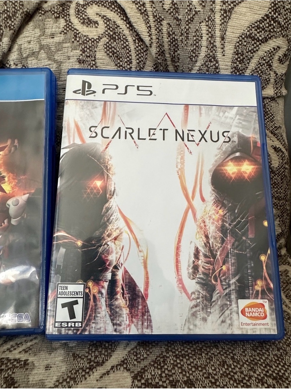 Scarlet Nexus (PS5) - Bandai Namco - White & Black with Orange Accents